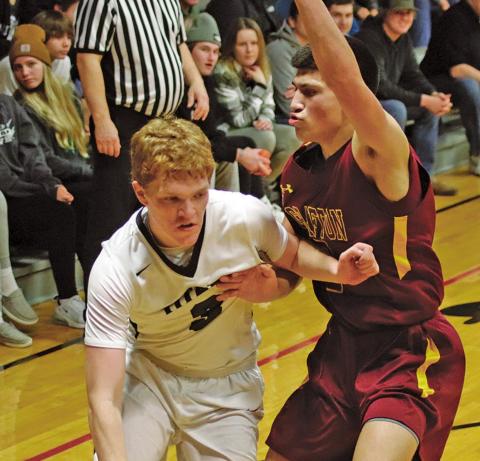 Brayden Johnson attempts to dribble around Spoiler Tony Villarreal who fiercely guards him. VNV photo by Lesa Van Camp