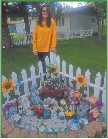 LeeAnn Johnson with one of her many fairy gardens. Photo by Christine Jensen