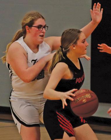 Isabella Douville guards a Polar Bear near their bucket in Tuesday nights matchup in Drayton. VNV Photo by Lesa Van Camp