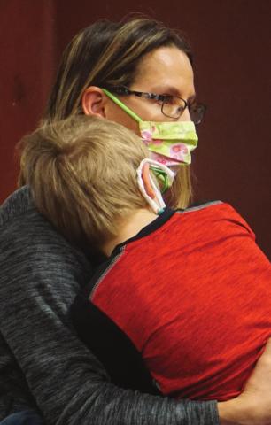 Darla Hoyles and son Erich watch the Titans girls in action on Saturday. Seven year old Erich later joined the VNV staff and took a few pictures of the game. VNV Photo by Lyle Van Camp