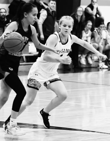 Alyssa Hoyles plays strong defense against the Lady Warriors. Photo by Lyle Van Camp.
