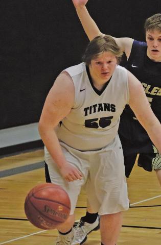 Joey Bjornson goes after a loose ball against North Border in the Drayton Gym last week. VNV Photo by Lesa Van Camp