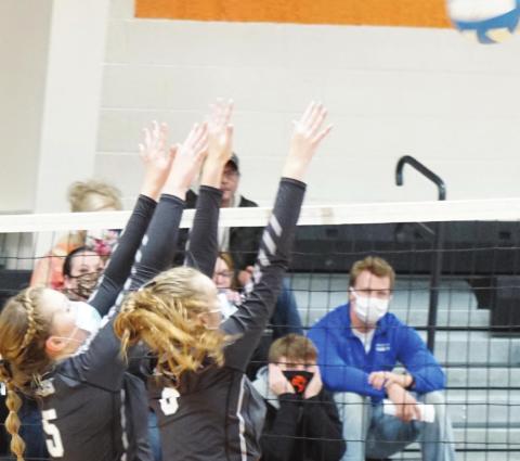 Kasey Stegman and Chloe Gemmill go up for a block against Cavalier last Friday evening. VNV Photo submitted by Lyle Van Camp