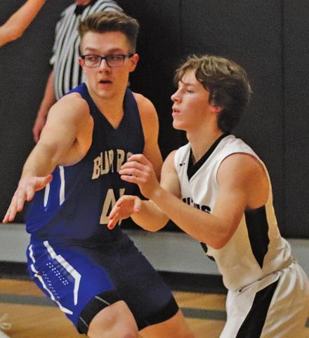 Logan Wieler is guarded by Burro Caden Waterworth last Friday night. VNV photo by Lesa Van Camp