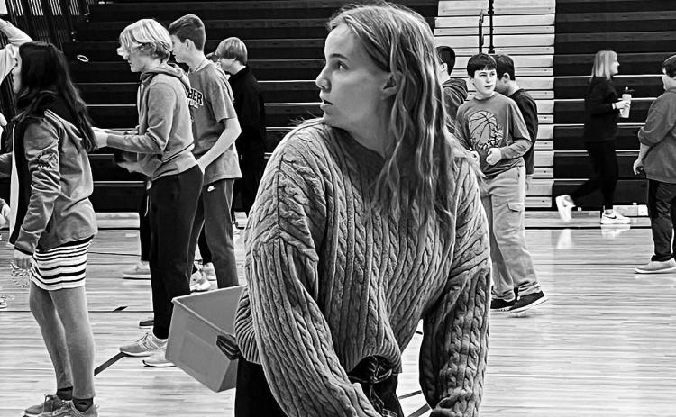Aleah Pokzrywinski catching snowballs.