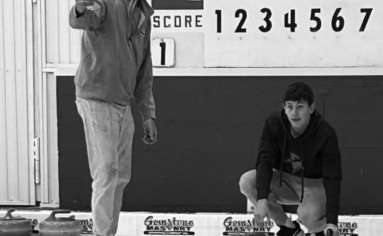 Christopher Longtin takes instruction from Tom Grzadzieleski. Photo courtesy of Pembina County 4-H
