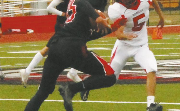 Defender Lucas De Souza chases down a White Shield ball carrier to prevent a first down. Photo by Jamie Rarick