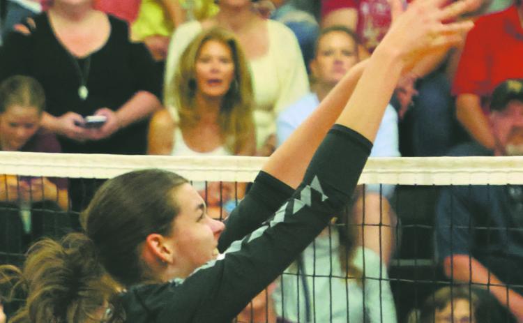 Elizabeth Fedje puts a kill attempt over the net in action in Drayton last week. Photo by Lyle Van Camp