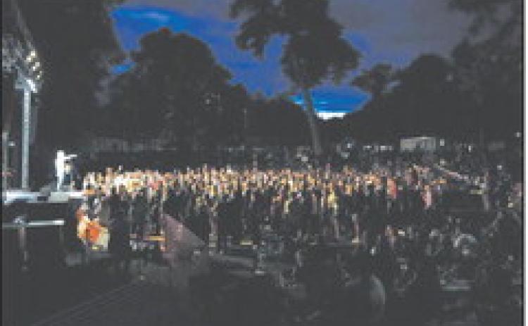 A crowd of thousands of worshippers gather in the Cavalier City Park for Off the Charts as Tenth Avenue North performs. Photo by Larry Stokke