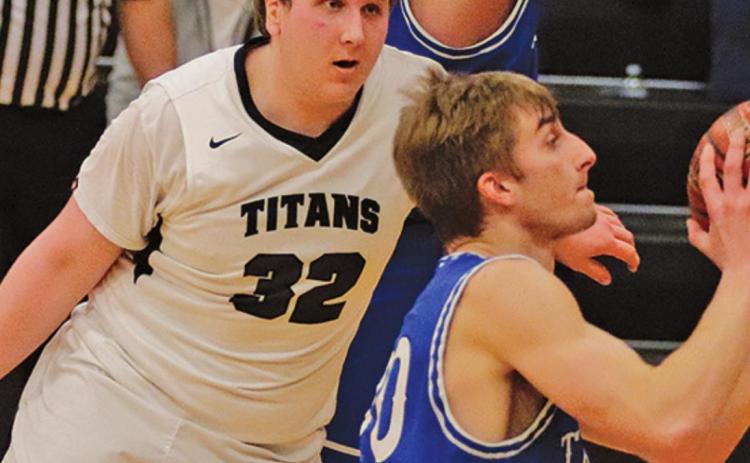 Lukas Pastorek guards one of the Hatton Northwood Thunder players in the last regular season game in Drayton last week. VNV Photo by Lesa Van Camp