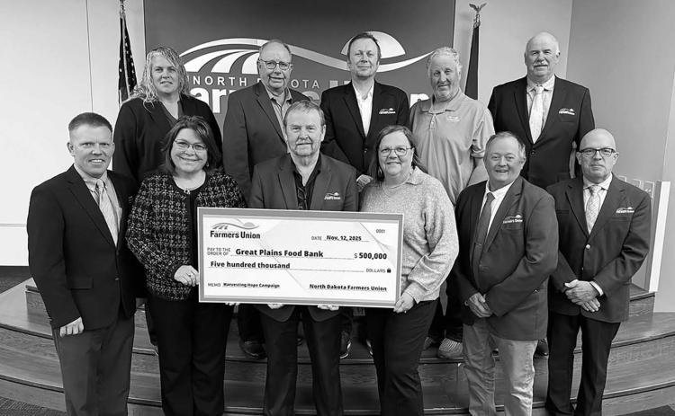 Pictured with NDFU President Mark Watne and the NDFU State Board of Directors are Marcia Paulson (at left), GPFB philanthropy officer, and Michelle Watne, Harvesting Hope Campaign honorary co-chair.