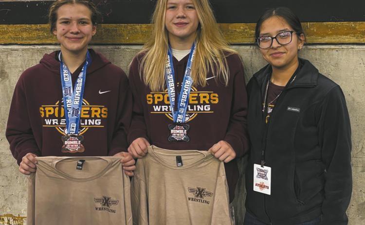(L-R) Violet Hoyles (Drayton) placed third in the 124 weight class, Alyssa Hoyles (Drayton) placed second in the 130 weight class and Dylienna Solis (Grafton) did not place in her weight class at the Rumble on the Red Tournament in Fargo. Photo courtesy of Spoilers Wrestling
