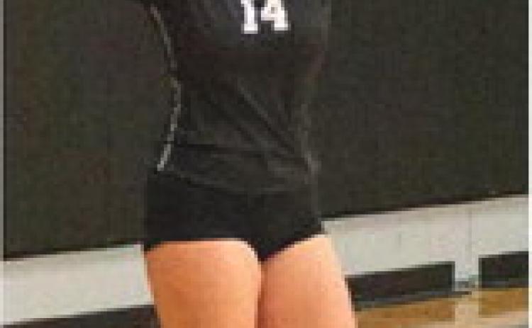 Aleah Pokrzywinski concentrates on her serve against HVC. Photo by Lyle Van Camp.