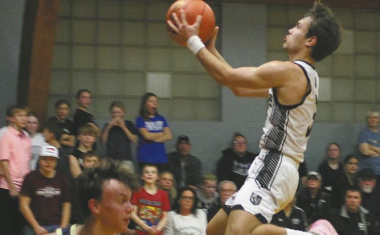 Sailing through the air, Trenten Keena lands the shot. Photo by Jamie Rarick