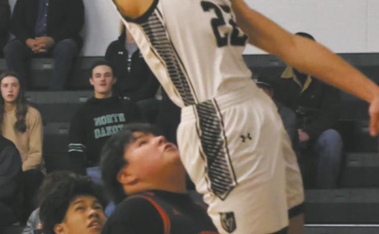 Sprinting down the court, DVE's Mason Pollestad wows the crowd with an impressive dunk. Photo by Jamie Rarick