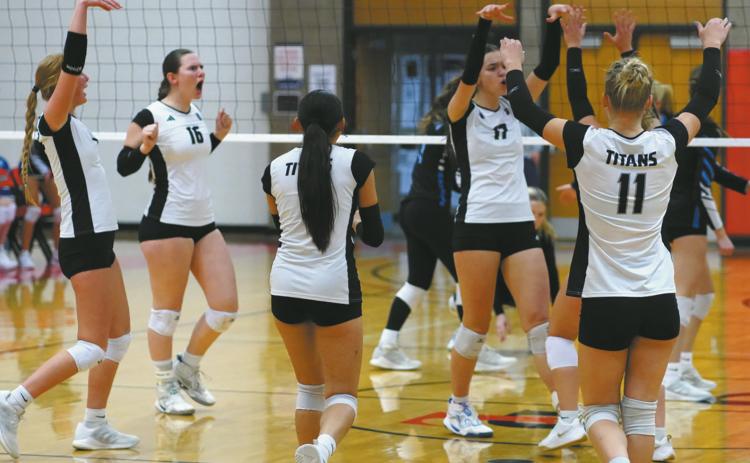 The team celebrates their hard work this season at the Region 2B Volleyball Tournament in Devils Lake, N.D. Photo by Larry Stokke.