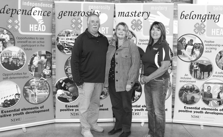 The Nelson family is recognized as a North Dakota 4-H Century Family. Pictured from left: Brent Nelson; Becky Nelson and Becky Peterson, North Dakota 4-H Foundation chair. (NDSU photo)