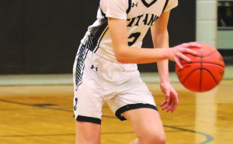 Quinn Passa brings the ball up the court against North Star.