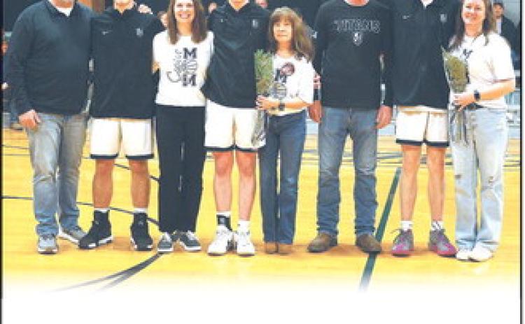 Together with their parents, DVE seniors Isaac Feltman, Frankie Duff, and Jack Langerud were recognized before Tuesday evening's game versus Park River in Crystal.  Photo by Jamie Rarick