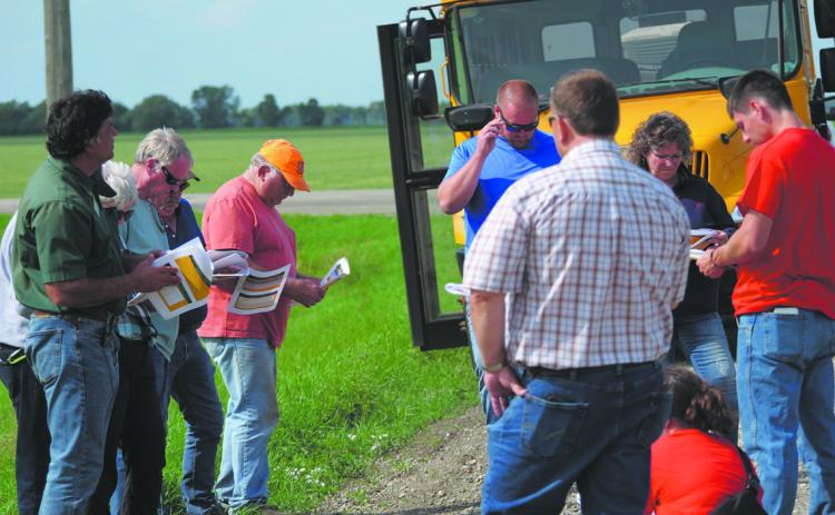 A Walsh County Soil Health Tour brought together 40 participants to learn more about soil loss, erosion and soil health in July 2023. Here, Naeem Kalwar [left side in the green shirt], a soil health specialist from the NDSU Langdon Research Extension Center, leads the talk. Photo provided by Josh Anderson, Walsh County district conservation manager.