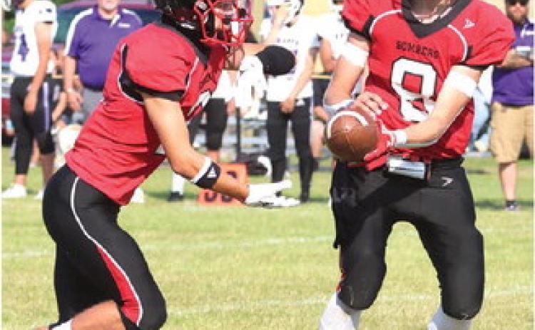 Trenton Keena receives a handoff from Gavin Ryan. Photo by Lyle Van Camp.