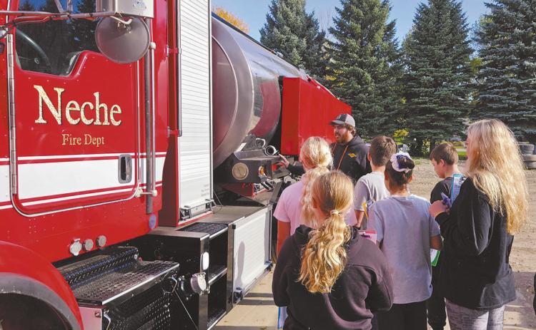 Drayton seventh graders visited CVR Industries in Neche and learned how the company repurposed an old milk truck into a fire truck for the Neche Fire Department. Photo by Jamie Rarick