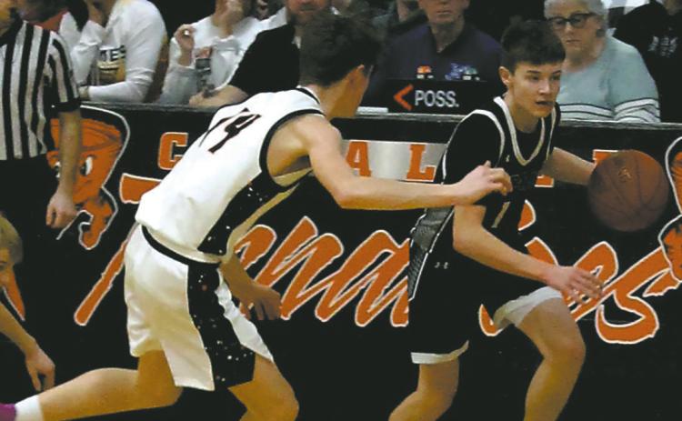 DVE Senior Drew Passa drives down the court past the Cavalier defense. Photo by Jamie Rarick