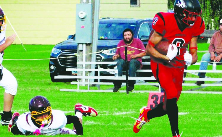 Breaking the tackle, Bomber senior tight end Mason Pollestad outruns the defense for a large gain during Saturday's game versus Mandaree. Photo by Jamie Rarick