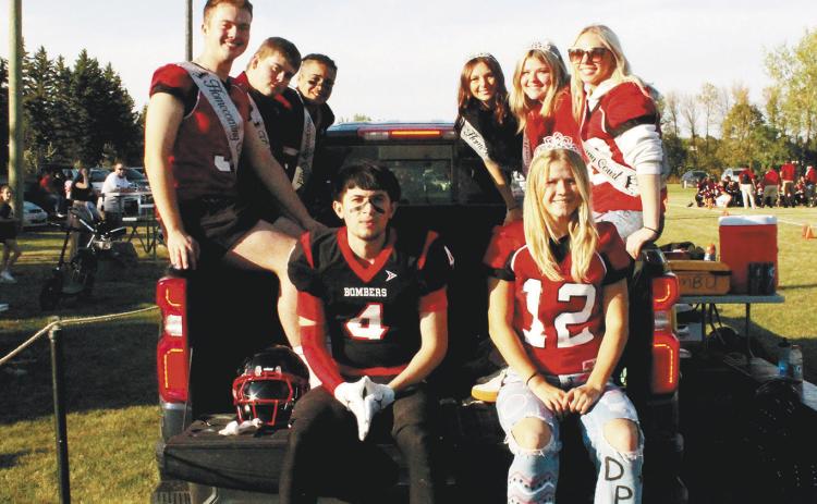 Members of the homecoming court rode along the sidelines during halftime of Saturday's game. Pictured: (On gate: King Trypp Castillo, Queen Alyssa Hoyles Back from left: Junior Attendant Maddox Oihus, Jaxon Wilson, Jerimiah Johnson, Taylor Hermanson, Alyvia Quibell, Junior Attendant Hope Patterson.) Photo by Jamie Rarick