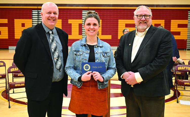 Randy Richards (left), policy director for U.S. Senator Kevin Cramer, and Tom Brusegaard (right), regional director for U.S. Senator John Hoeven, congratulate Milken Educator Award recipient Katelyn Gorder. Photo courtesy of the Milken Family Foundation.