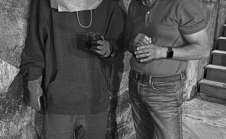 Yours truly with Mr. X in a sewer enjoying cigars and old fashions. Interviewing is hard work.