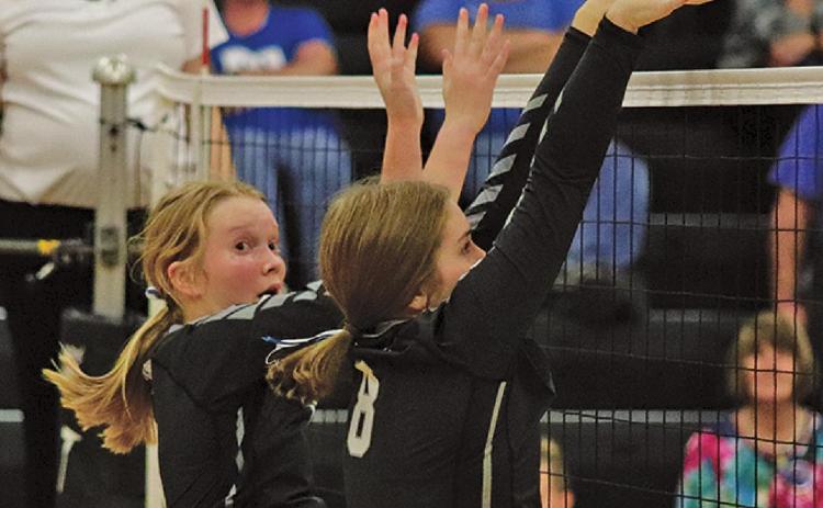 Easton Larson (l) and Kiara Aasand (r) go up for the block against the Hillsboro - Central Valley Burros last Thrusday night in the Drayton gym. VNV Photo by Lesa Van Camp