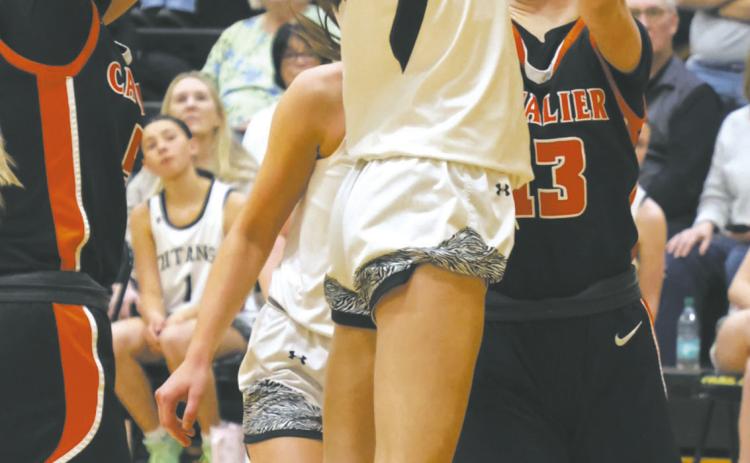 Fighting for the open shot, DVE's Gianna Hall fights a group of Cavalier defenders. Photo by Jamie Rarick