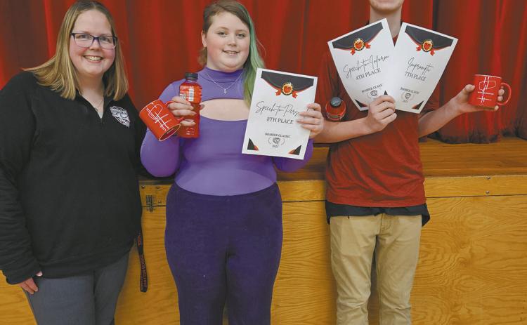 Speech coach Jamie Rarick with DPS winners Stephanie Kissee and Jonah Rarick. Submitted photo