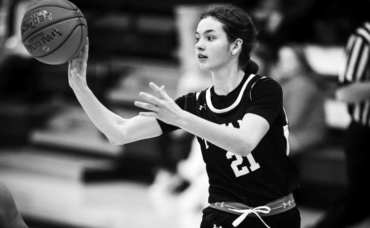 Elizabeth Fedje makes a pass at Hillsboro on Dec. 6. Photo by Cole Short - Hillsboro Banner.