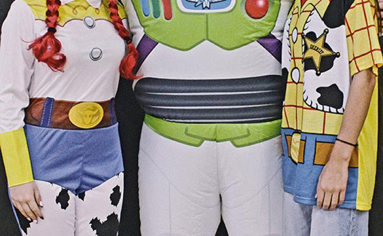 Seniors Hope Patterson, Maddox Oihus, and Mikala McCoy dress as Toy Story characters Jessie, Buzz Lightyear and Woody during Character Day. Photo by Jamie Rarick