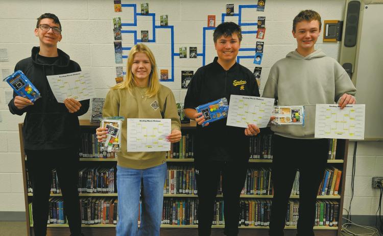 In the month of Mch,ar the Drayton High School Library put on a 'Best Bracket' contest, with students and staff voting on their favorite books after filling out brackets with their predicted results. The competition was tough, but the overall choice for best book was The Outsiders, by S.E. Hinton. Winners of the bracket contest are pictured as follows: Jonah, Alyssa, Hunter, and Chey. Thank you to everyone who participated and congratulations to the winners!