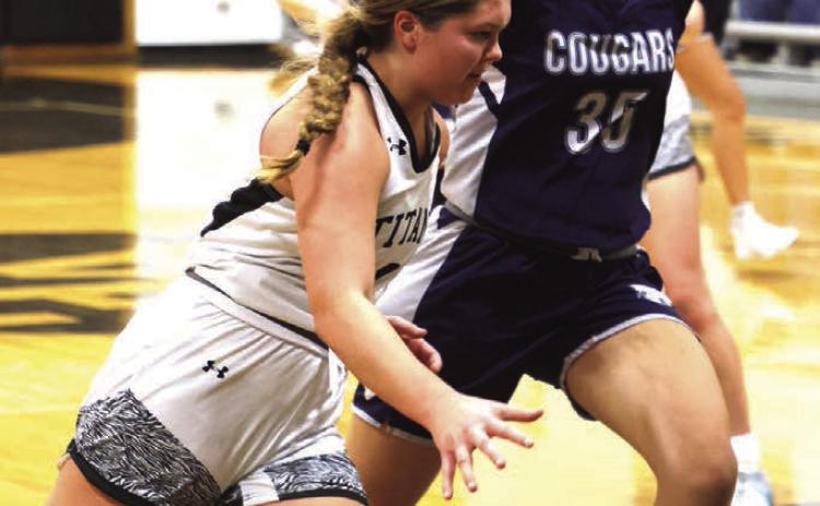 Brooke Gullickson drives past North Prairie's Morgan Casavant.