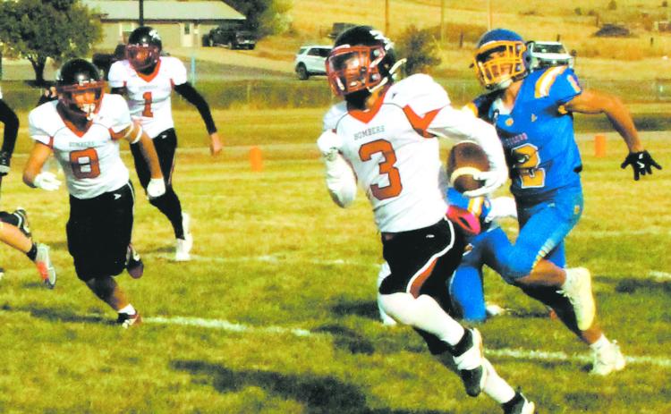 Trenten Keena outruns the Tiger defense to score another Bomber touchdown. Photo by Jamie Rarick.