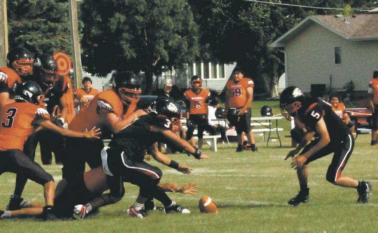 Bomber defenders Trenten Keena and Lucas De Souza dive for a Warwick fumble. Photo by Jamie Rarick