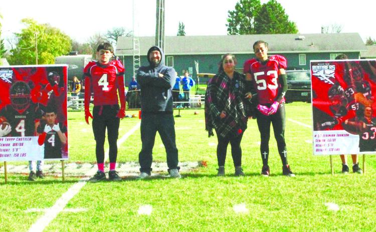 Bomber football seniors and their parents were recognized prior to Saturday's game. Pictured are seniors Trypp Castillo and Jerimiah Johnson with their parents. Photo by Jamie Rarick.