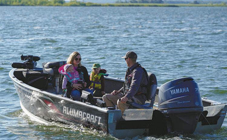 North Dakota state law requires kids 10 and under to wear a life jacket in boats under 27 feet. Photo by NDGF