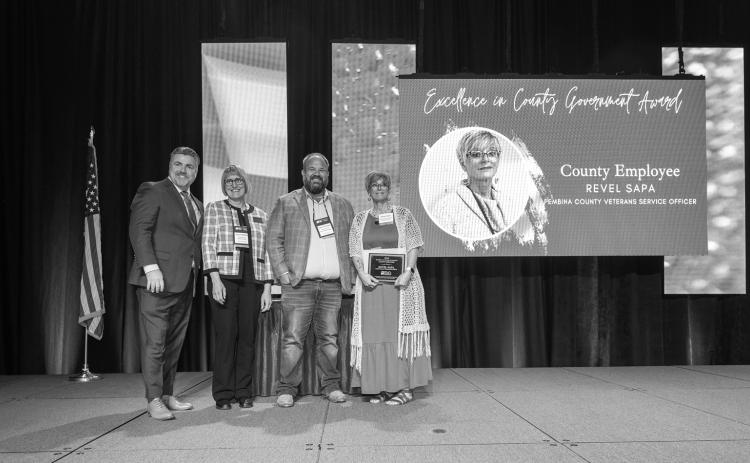 NACo Executive Director Aaron Birst, NDACo President Jayme Tenneson, NDCCA President Joan Hollekim, EICG Award Recipient Revel Sapa, Pembina County Veterans Services Officer. Submitted photo