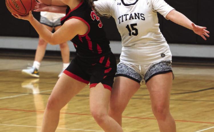 Aleah Pokrzywninski fights for control of the ball.