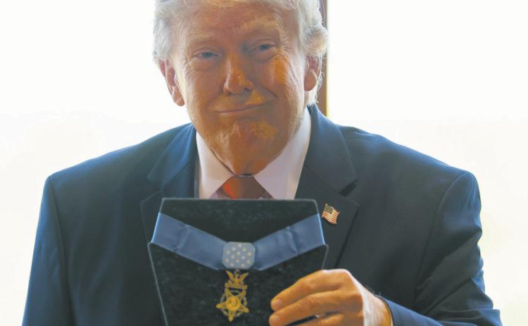 President Donald Trump poses with Theodore Roosevelt’s Medal of Honor during the dedication of the Theodore Roosevelt Presidential Library on July 1, 2026, in Medora, North Dakota. Photo by Tasos Katopodis/Getty Images for Theodore Roosevelt Presidential Library