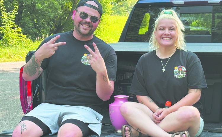 Rob and Nicole Louthain sit with their daughter Katarina's urn before the inaugural Katarina's Sunshine Ride on Saturday at Turtle River State Park near Arvilla. More than 100 participants joined the approximately 115-mile ride honoring Katarina’s memory and raising awareness about impaired and distracted driving.