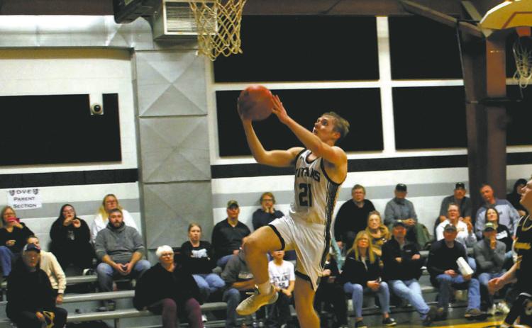 DVE sophomore Carter Oberg goes up for the basket. Photo by Jamie Rarick