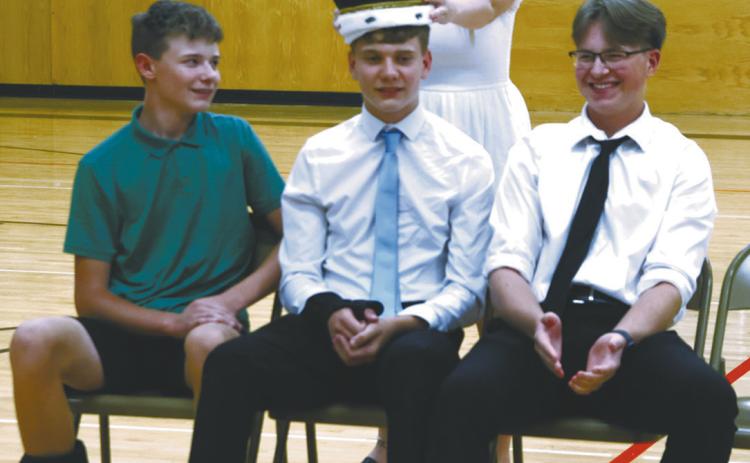 2023-2024 Homecoming Queen Claire Thompson crowns Quinn Passa 2024-2025 Homecoming King. Also pictured are Drew Passa and JJ Knutson. Photo by Lyle Van Camp