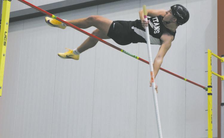 DVE junior Carter Johnson clears the bar in pole vault, winning the meet with a personal best of 11' 3'. Photo by Jamie Rarick