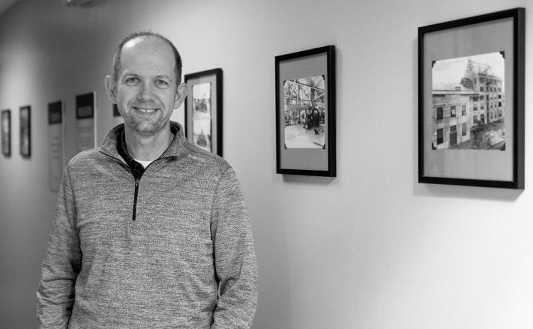Zach Olson shares a look back with the factory’s “wall of history” as the East Grand Forks location recognizes its 100-year anniversary of sugarbeet processing in the Red River Valley